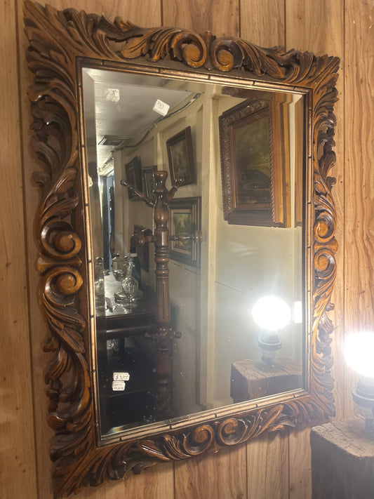 Carved mirror