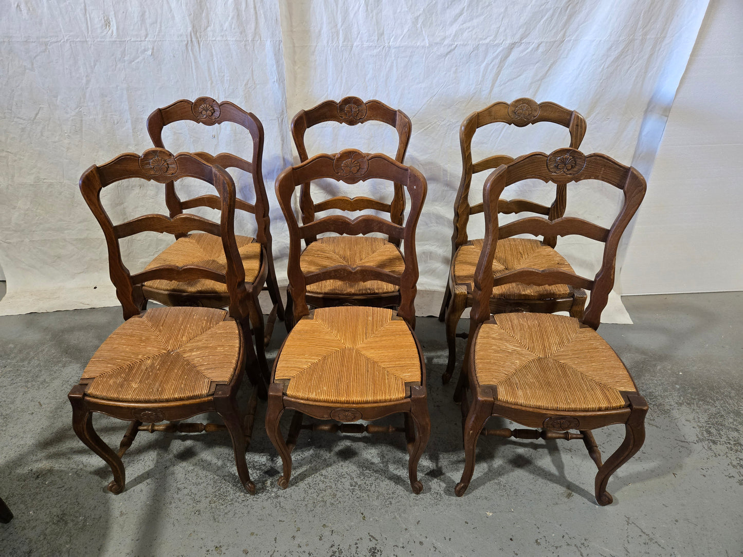 Early century oak ladderback rush chairs