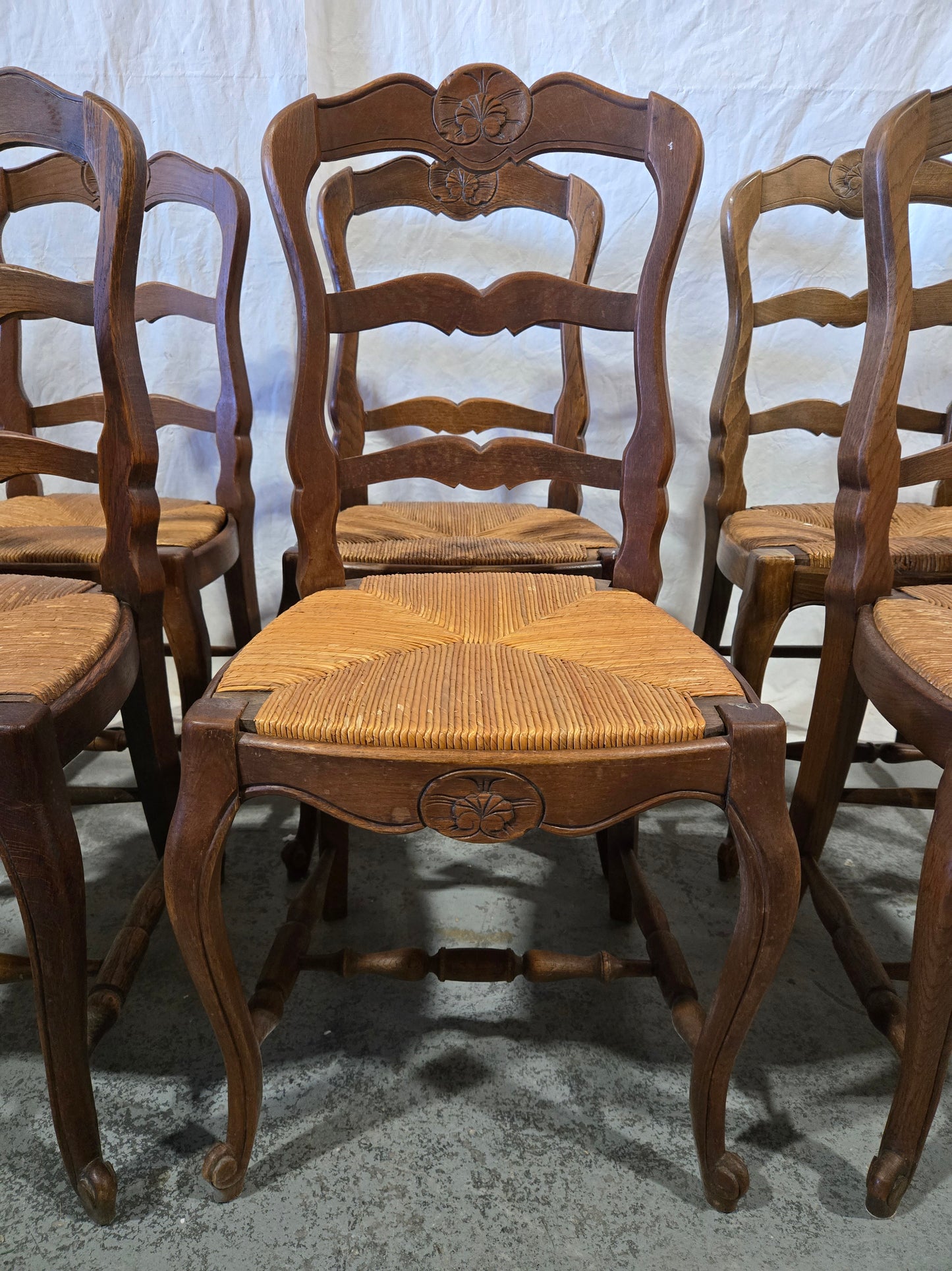 Early century oak ladderback rush chairs