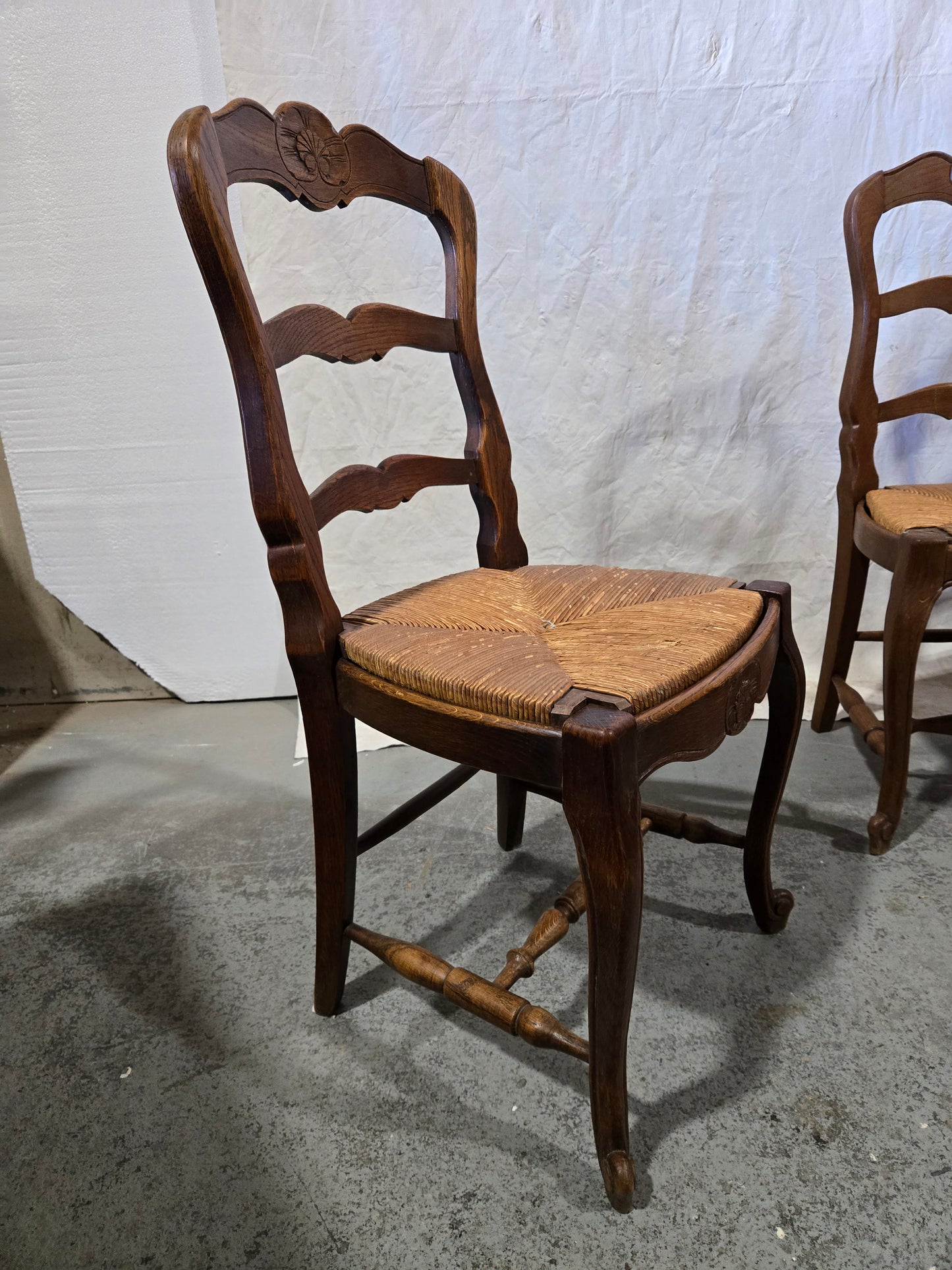 Early century oak ladderback rush chairs