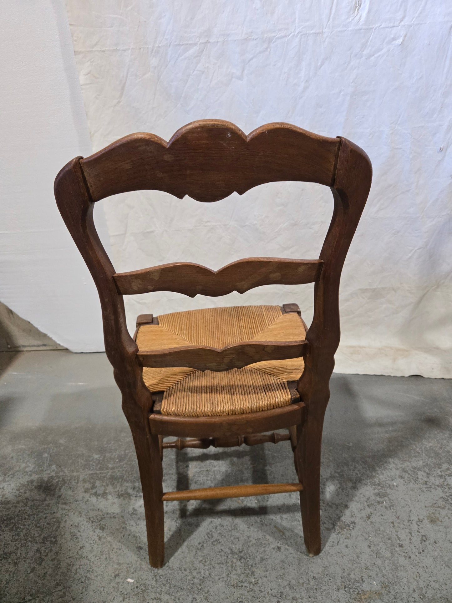 Early century oak ladderback rush chairs