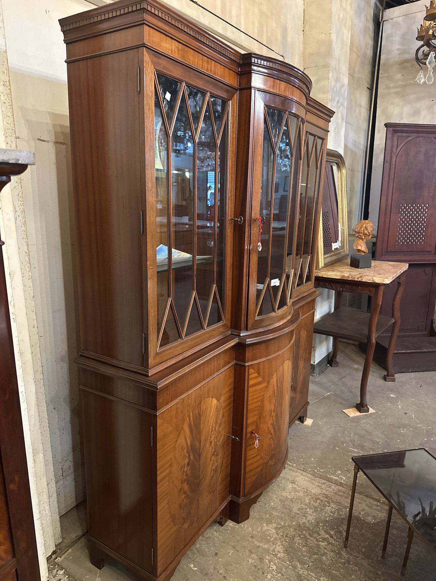 Mid 1900s Georgian mahogany breakfront China cabinet