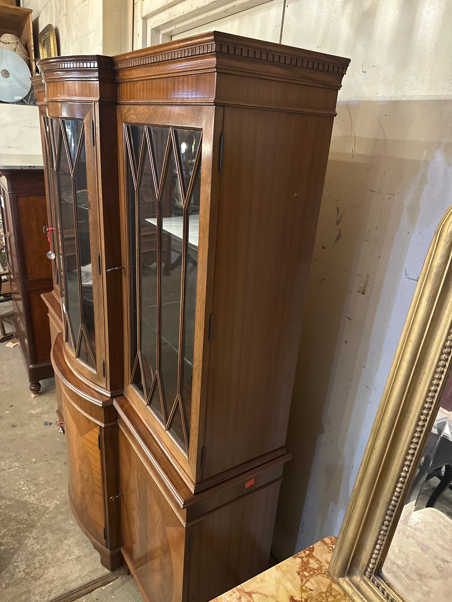 Mid 1900s Georgian mahogany breakfront China cabinet