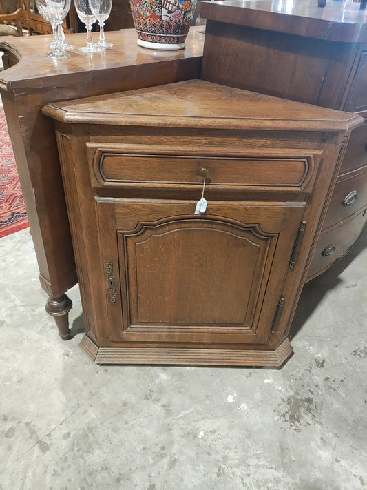 Late 19th century French Provincial corner cabinet