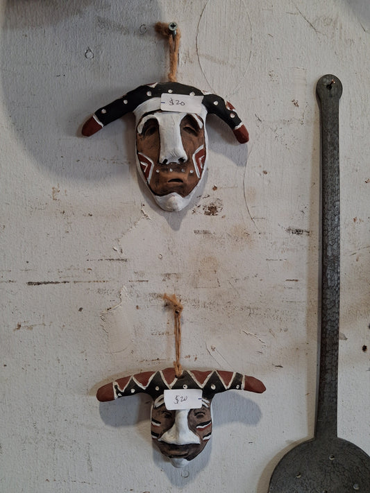 Hand-carved tribal-style wall décor