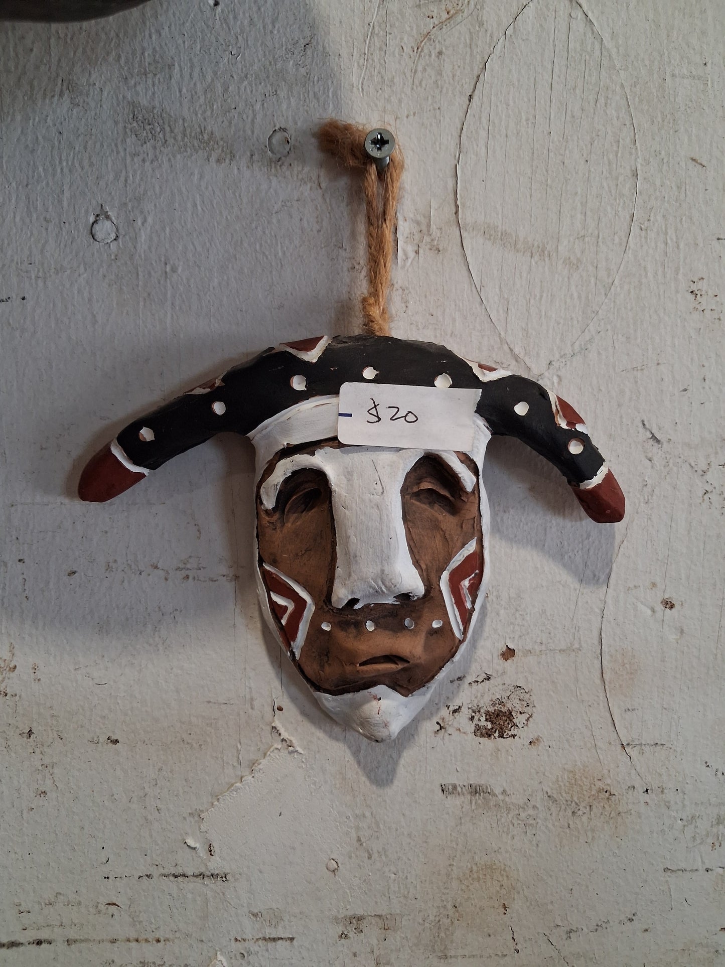 Hand-carved tribal-style wall décor